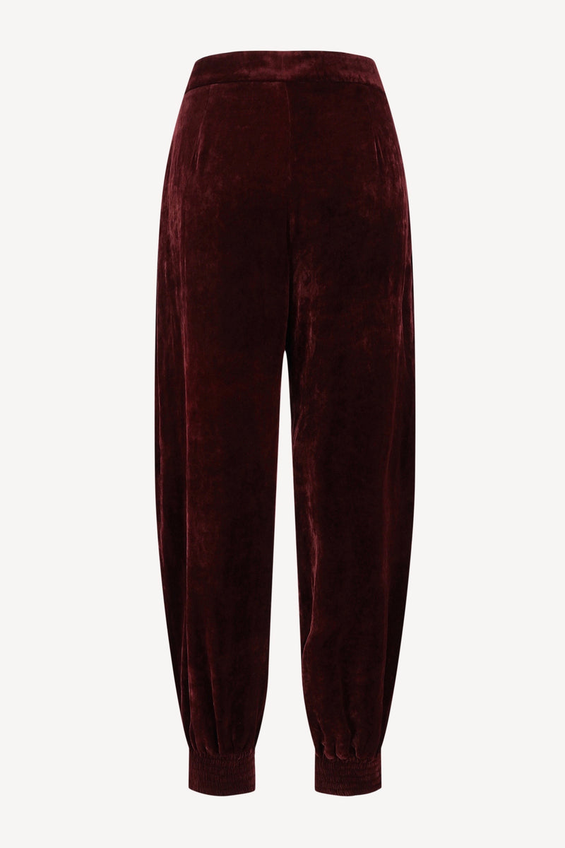 Velvet trousers in bordeaux